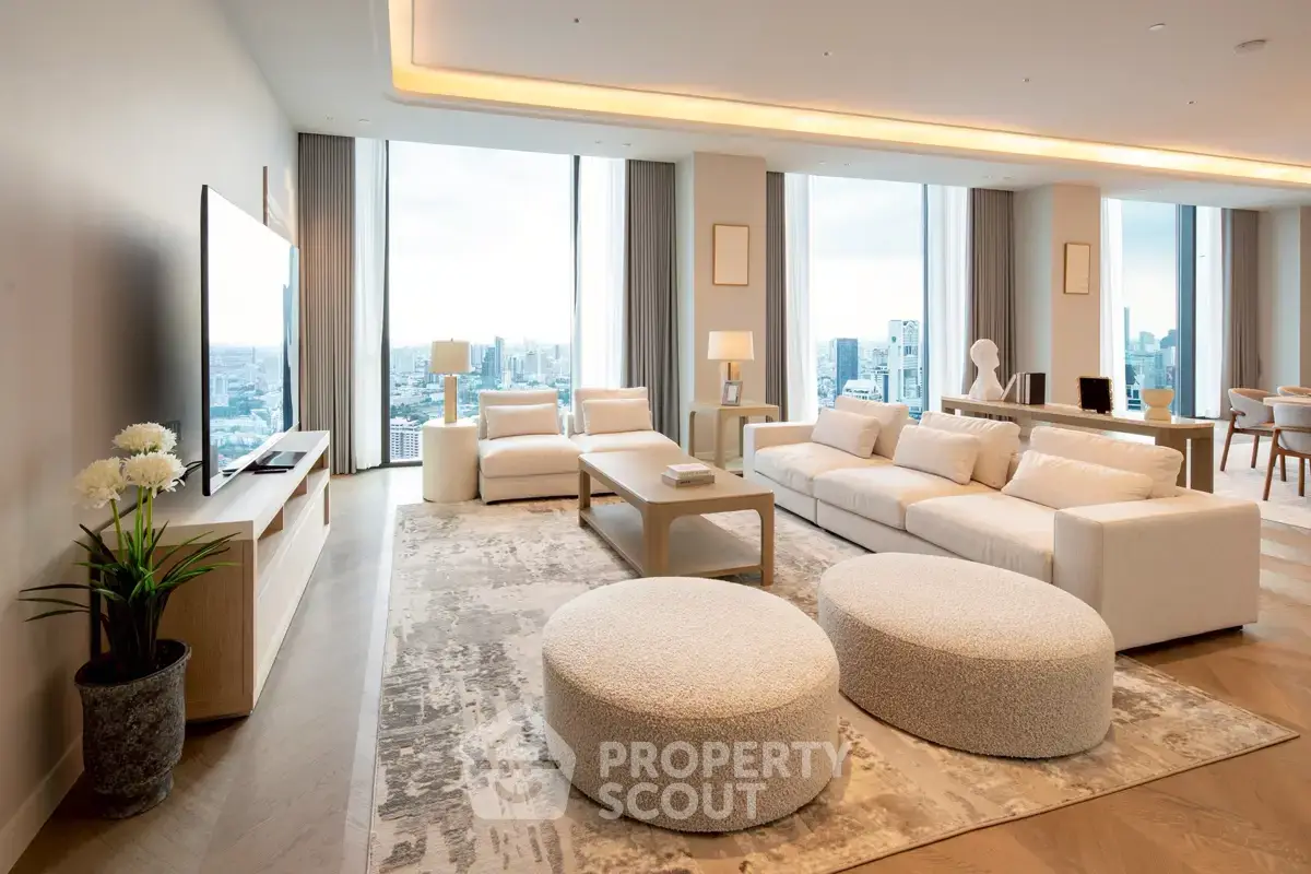 Luxurious modern living room with panoramic city views and elegant furnishings.