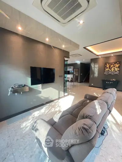 Luxurious living room with modern decor and plush seating, perfect for relaxation and entertainment.