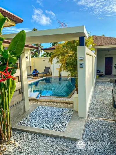 Stunning tropical villa with private pool and lush garden, perfect for luxury living.