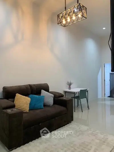 Modern living room with stylish lighting and cozy sofa