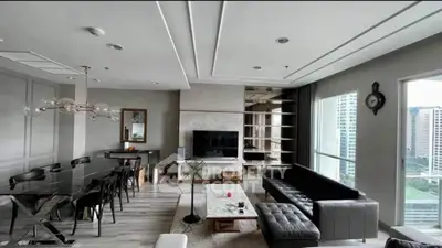 Spacious modern living room with elegant dining area and city view, featuring sleek furniture and stylish decor.