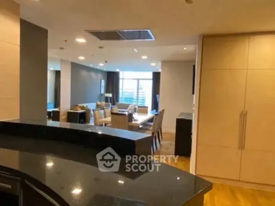 Spacious modern living room with open layout and elegant furnishings.