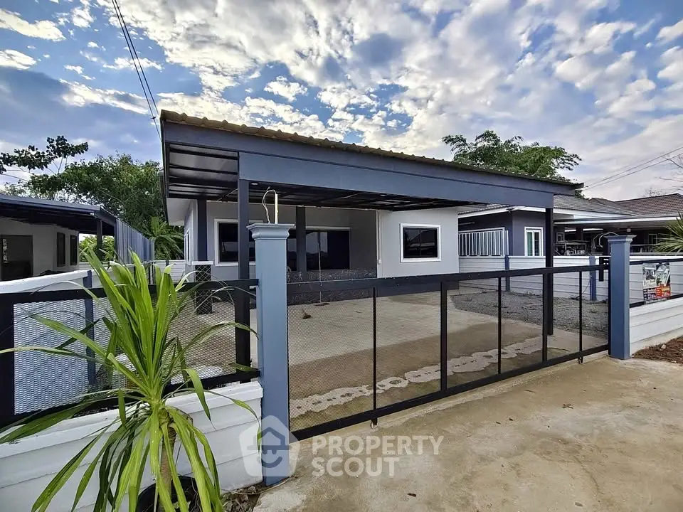 Charming single-story home with modern design and spacious driveway, perfect for family living.