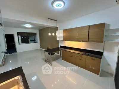 Modern kitchen with sleek cabinets and open layout design