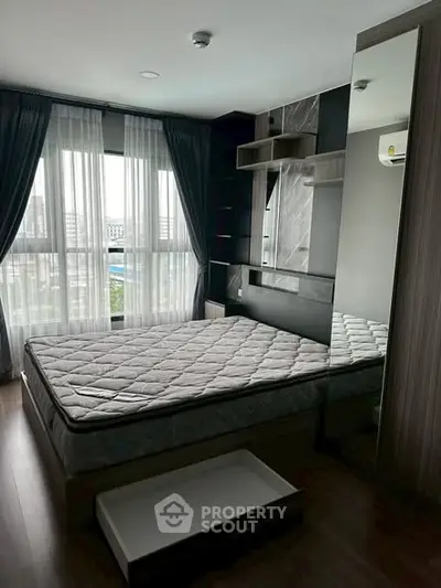 Modern bedroom with large windows and stylish decor