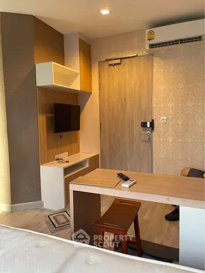 Modern studio apartment with compact living area and stylish decor