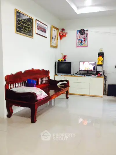 Cozy living room with wooden furniture and entertainment setup