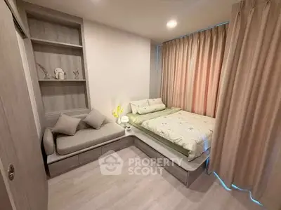 Cozy bedroom with modern decor and built-in shelving, featuring a comfortable bed and stylish sofa.