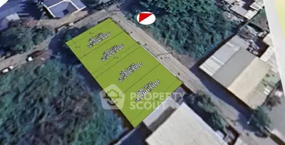 Aerial view of plotted land for sale with clear boundaries and measurements.