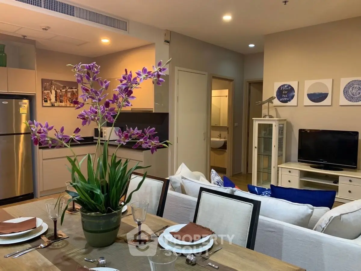 Stylish open-plan living room with dining area and modern kitchen