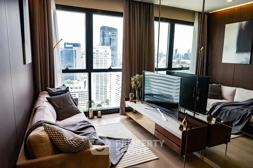 Modern living room with city view, sleek furniture, and large windows in a high-rise apartment.