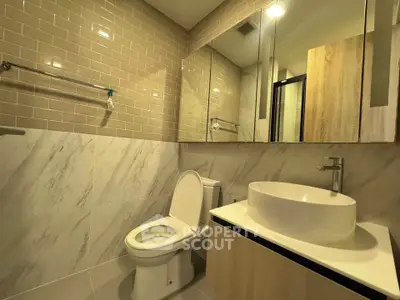 Modern bathroom with stylish fixtures and elegant tile design