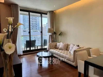 Elegant living room with modern decor and balcony view