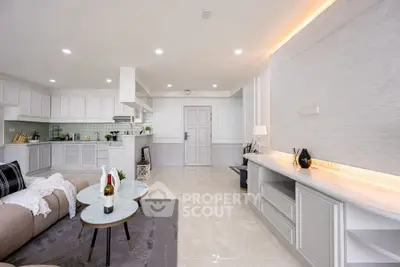 Spacious modern living room with open kitchen and elegant decor