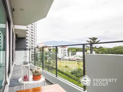 Spacious balcony with scenic views in modern apartment complex