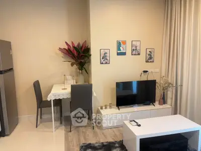 Cozy living room with modern decor, TV unit, and dining area, perfect for urban living.
