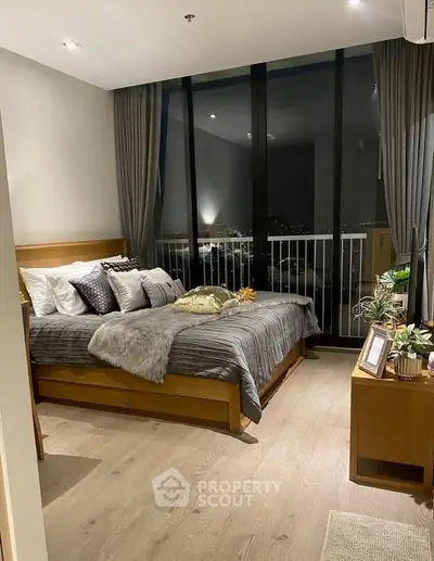 Luxurious bedroom with floor-to-ceiling windows and elegant decor