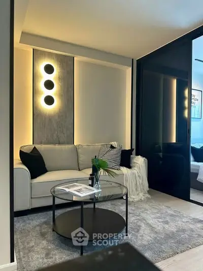 Modern living room with stylish lighting and cozy decor