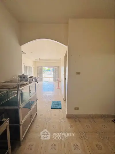 Spacious living area with open layout and natural light, leading to a large balcony.