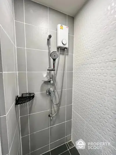 Modern bathroom with sleek shower design and textured tiles