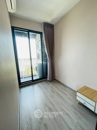 Modern minimalist room with balcony and wooden flooring