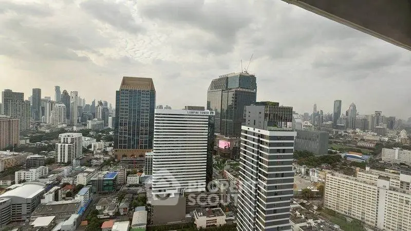 Stunning cityscape view from high-rise building showcasing urban skyline and modern architecture.