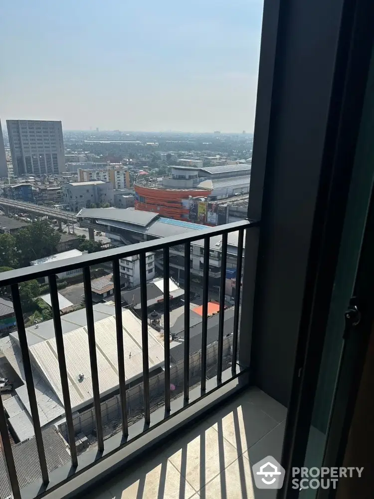 Stunning city view from high-rise balcony with panoramic skyline