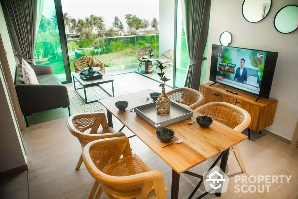 Modern living room with stylish decor and balcony view