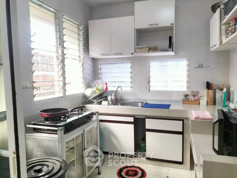 Cozy kitchen with modern appliances and ample natural light