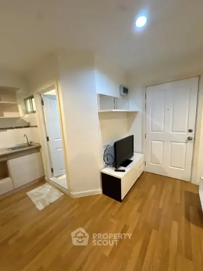Cozy apartment interior with wooden flooring and modern furnishings