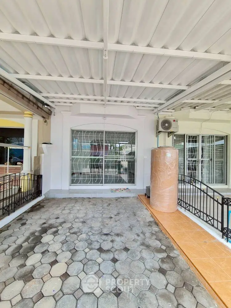 Spacious covered parking area with tiled flooring and modern design