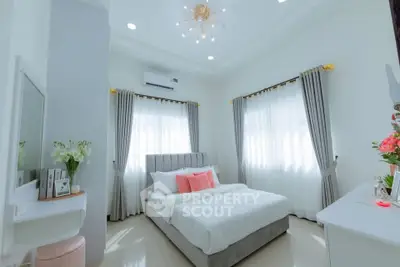 Elegant bedroom with modern decor and natural light