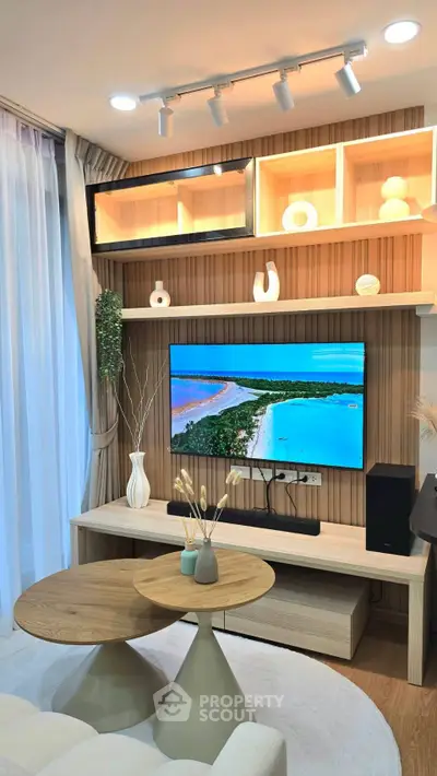 Modern living room with stylish decor and wall-mounted TV, featuring elegant wooden shelves and cozy lighting.