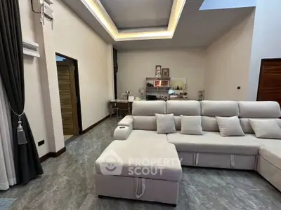 Spacious modern living room with elegant sofa and stylish decor