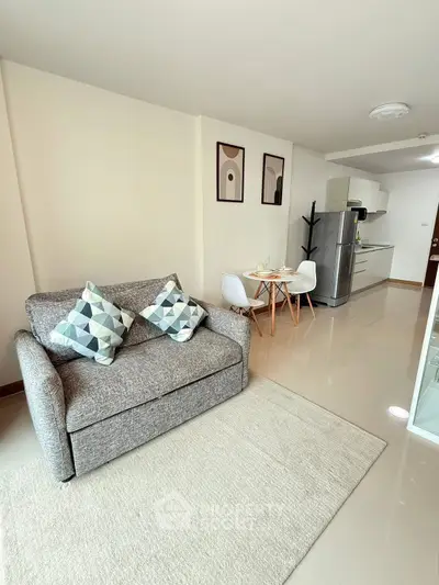 Modern open-plan living room with stylish kitchen and cozy dining area