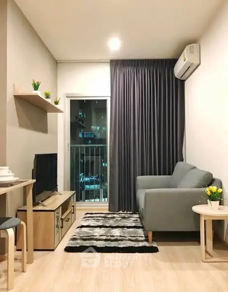 Modern living room with cozy sofa, stylish decor, and city view balcony.