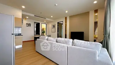 Spacious modern living room with open kitchen and elegant decor