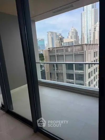 Modern apartment balcony with city skyline view, perfect for urban living.