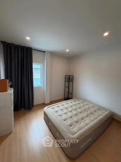 Spacious bedroom with inflatable mattress and modern decor
