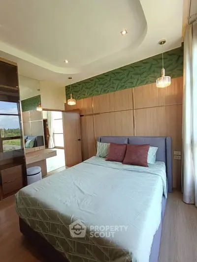 Elegant bedroom with modern design and large window offering scenic views
