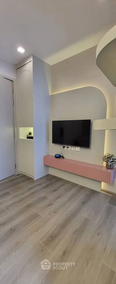 Modern living room with sleek TV setup and stylish decor