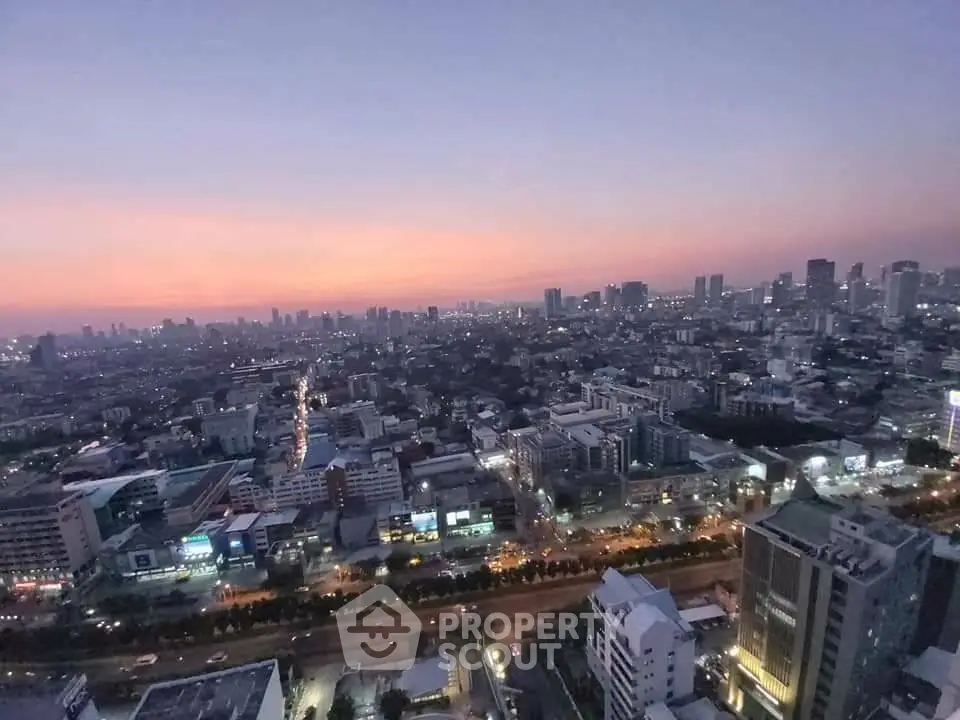 Stunning cityscape view at dusk with vibrant skyline and urban lights.