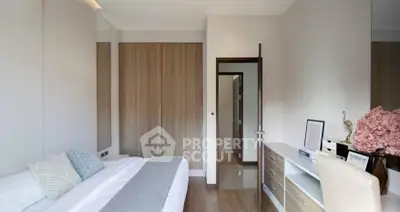 Modern bedroom with elegant decor and ample natural light