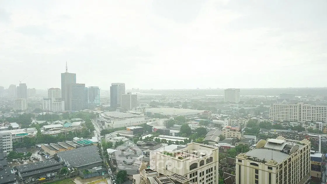 Stunning cityscape view from a high-rise building showcasing urban skyline and expansive horizon.