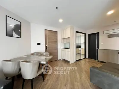 Modern living room with elegant dining area and open kitchen layout