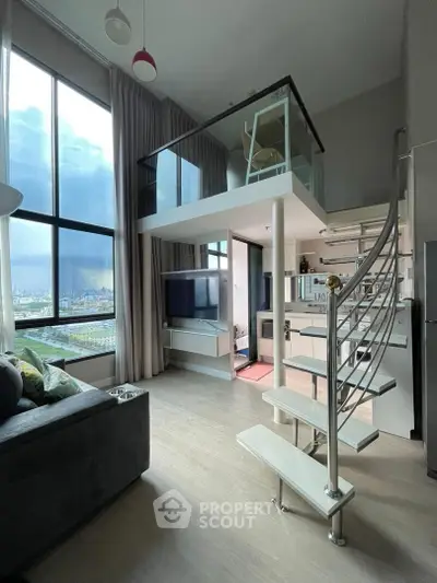 Modern loft apartment with high ceilings, large windows, and a stylish spiral staircase leading to a mezzanine.