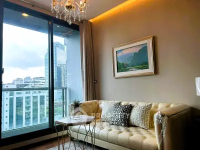 Luxurious living room with elegant chandelier and city view from large window.
