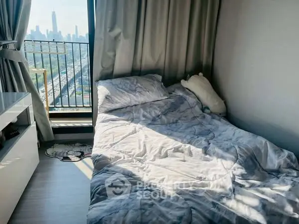 Cozy bedroom with city view and natural light