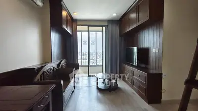 Charming living room with wooden furniture and balcony view in modern apartment