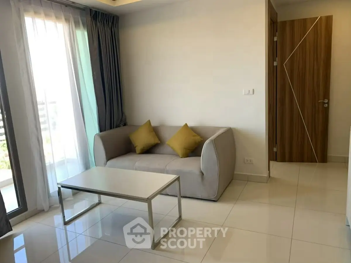 Modern living room with sleek sofa and natural light